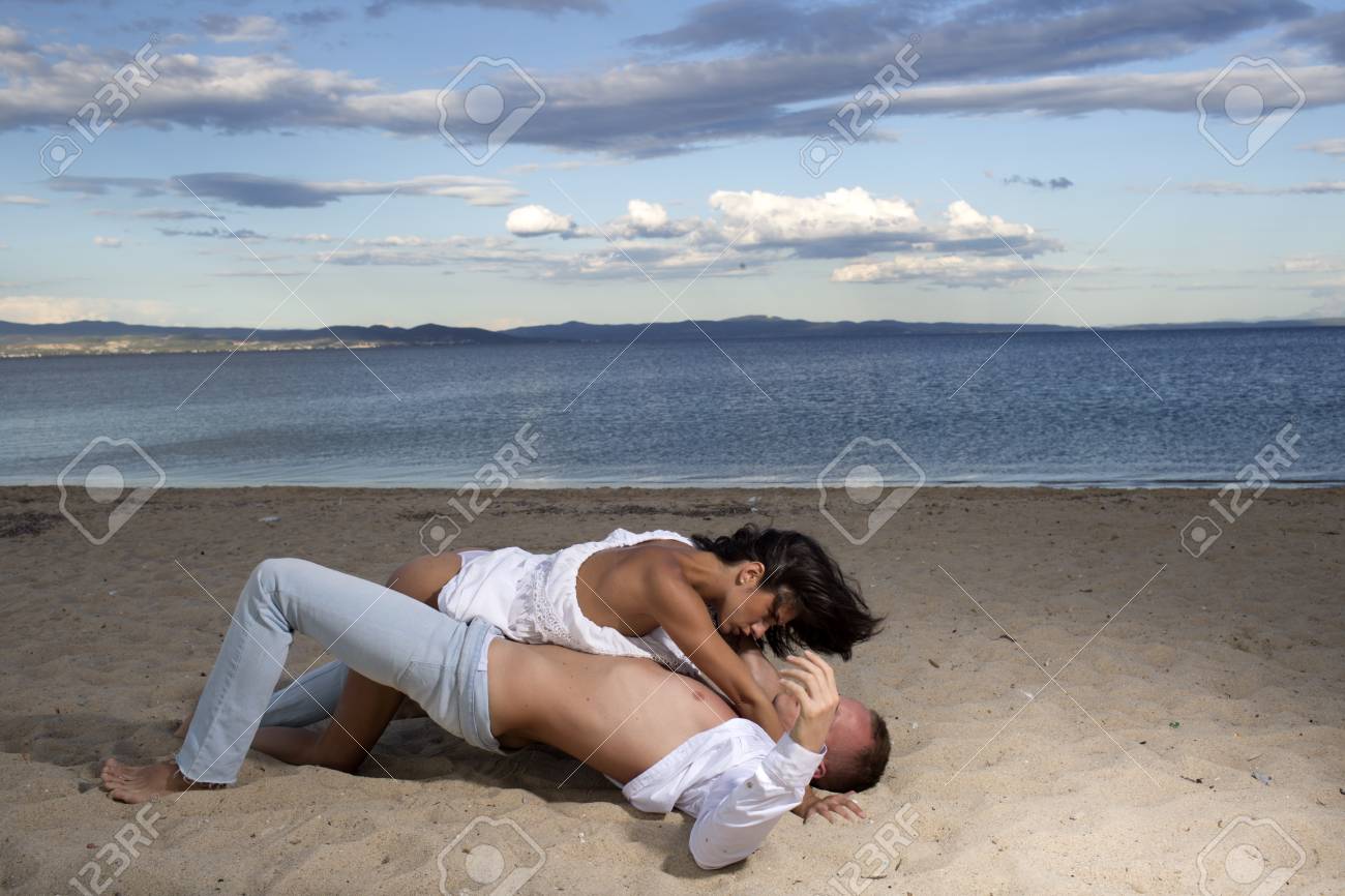 Black man and white woman kissing XXX