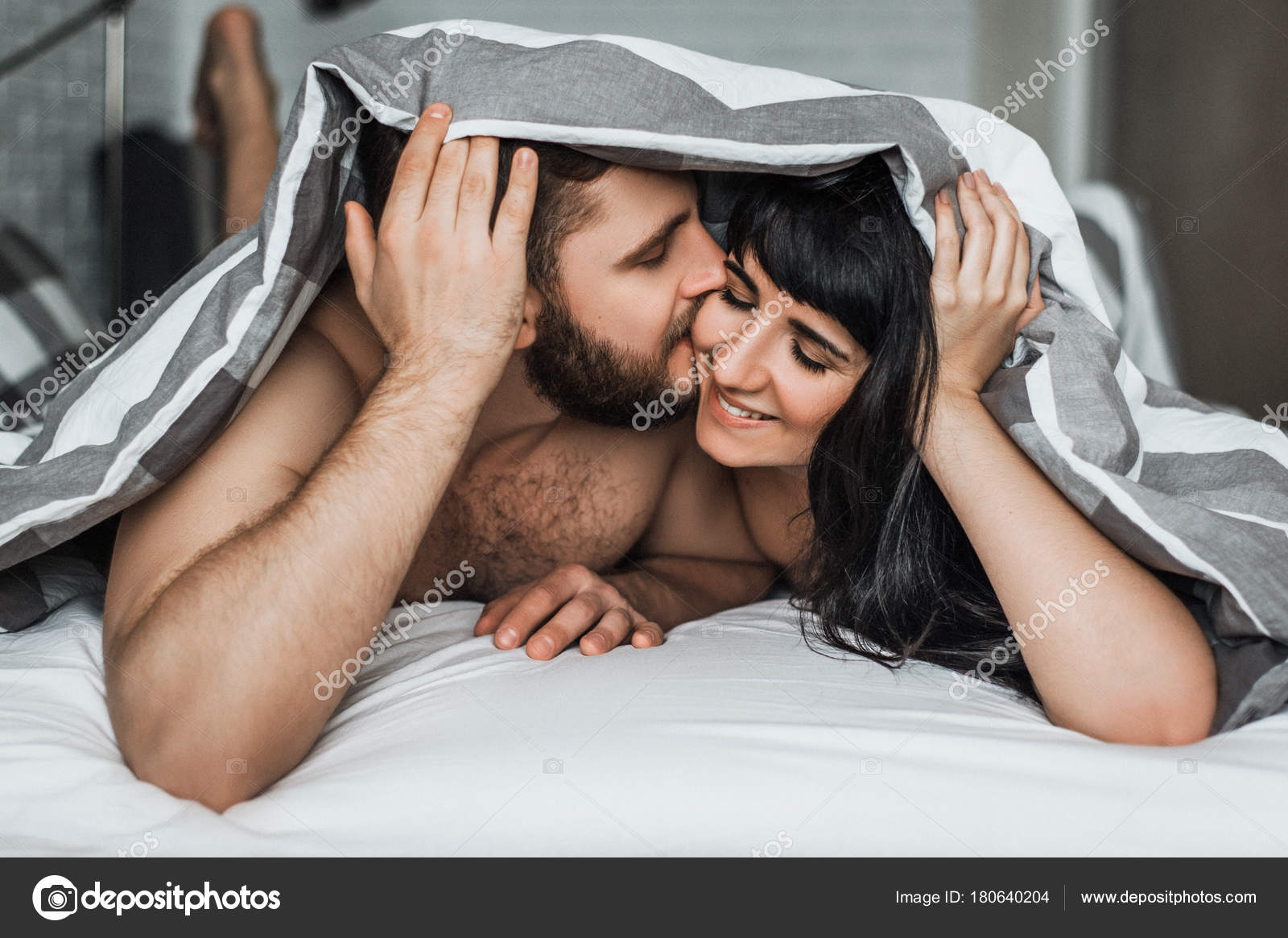 Girl kissing girl on bed